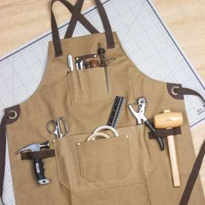 Forkle vokset kanvas med lær og messingdetaljer